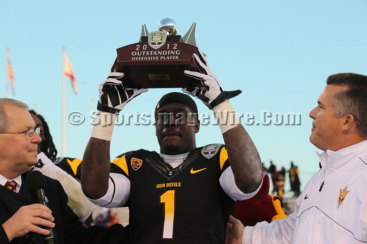 122912 Kraft SA-061.JPG - Dec 29, 2012; San Francisco, CA, USA; Arizona State Sun Devils tailback Marion Grice (1), flanked by Kraft Fight Hunger Bowl executive director Gary Cavalli (L) and ASU head coach Todd Graham (R), is named outstanding offensive player against the Navy Midshipmen in the 2012 Kraft Fighting Hunger Bowl at AT&T Park.